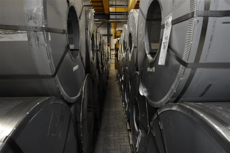Rows of stacked steel coils in an automated warehouse facility